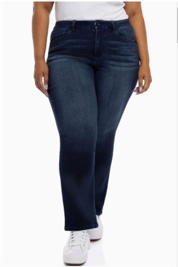 Mid-size woman wearing dark wash mid rise straight leg jeans styled with sneakers, comfortable everyday denim for women shopping in Rhode Island and across New England.
