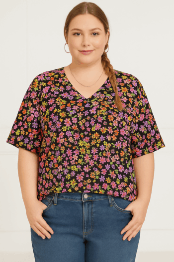 Plus size floral V-neck top in bold pink, orange & yellow blooms