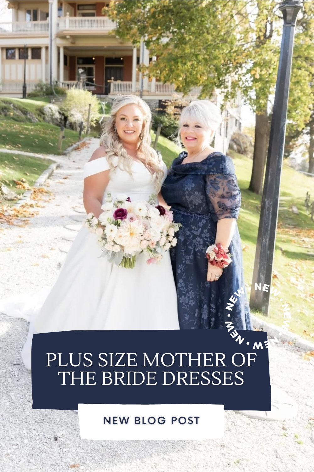 A smiling bride stands arm-in-arm with her mother, who wears a navy lace plus-size Mother of the Bride dress from Botticelli Boutique in Smithfield, Rhode Island.