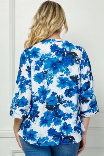 Back view of the Alena blue and white floral button-down blouse with relaxed fit and cuffed sleeves