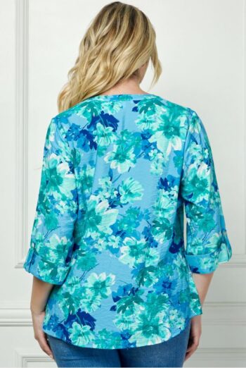 Back view of the Maren plus size button-down blouse with watercolor floral pattern in cool coastal tones