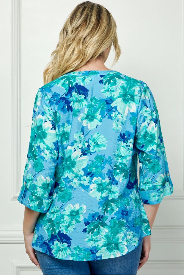 Back view of the Maren plus size button-down blouse with watercolor floral pattern in cool coastal tones