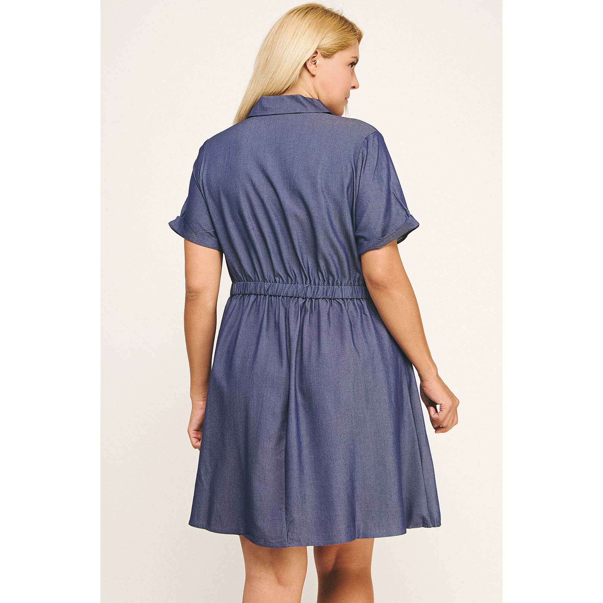 Back view of the Sloane silky chambray dress with elastic waist and short sleeves in dark wash