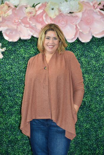 Plus-size model showcasing the Dear Scarlett Button Cozy Cardigan in Pumpkin Spice. Cozy, flowy design with a flattering drape and button detail. Perfect layering piece for any season, available in sizes S-3X.