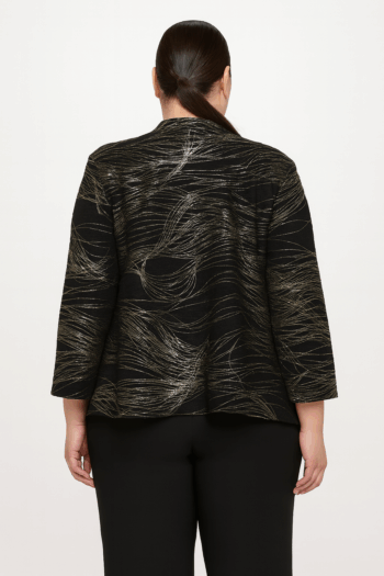 Back view of a plus-size model wearing the Lila black and gold jacket in a studio setting, featuring a flowing asymmetrical hemline and metallic swirl pattern on black textured fabric.