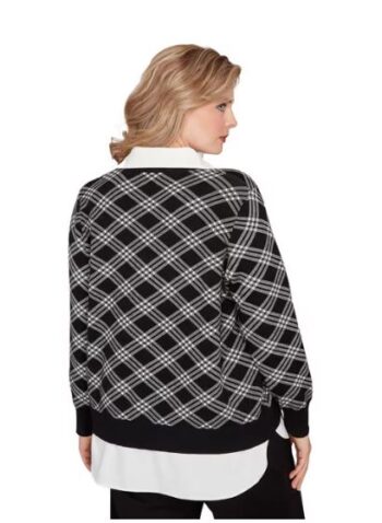 Back view of plus size mock layered black and white plaid sweater with ribbed cuffs and hem.