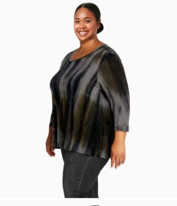 Plus size woman wearing a cozy olive and grey tie-dye knit top with 3/4 rolled sleeves, side view, relaxed fit.