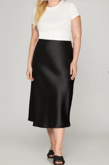 Black satin bias cut midi skirt styled for everyday and work outfits