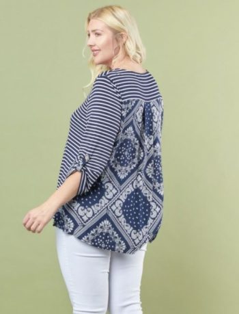 Plus size mixed print top with bandana detail and roll-tab sleeves styled with white pants.