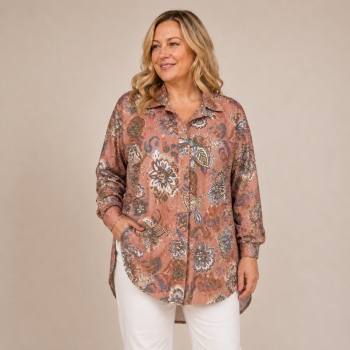 Mid-size woman wearing the Autumn Paisley Ribbed Shacket featuring a vintage-inspired paisley floral print, button-down front, classic collar, and curved hem.