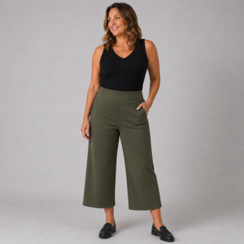 Petite model wearing olive pull-on ponte culottes with a wide-leg cropped silhouette, smoothing waistband, and side pockets.