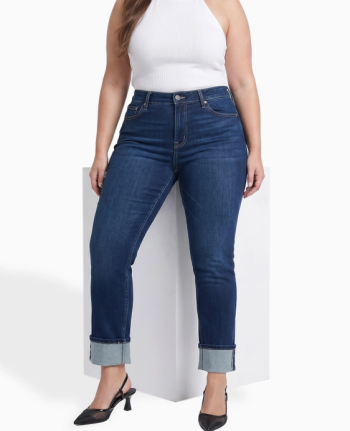 Mid-size woman wearing Dylan Cuffed Straight Leg Jeans in dark wash styled with a casual top, featuring a flattering high-rise fit and relaxed cuffed straight-leg silhouette.